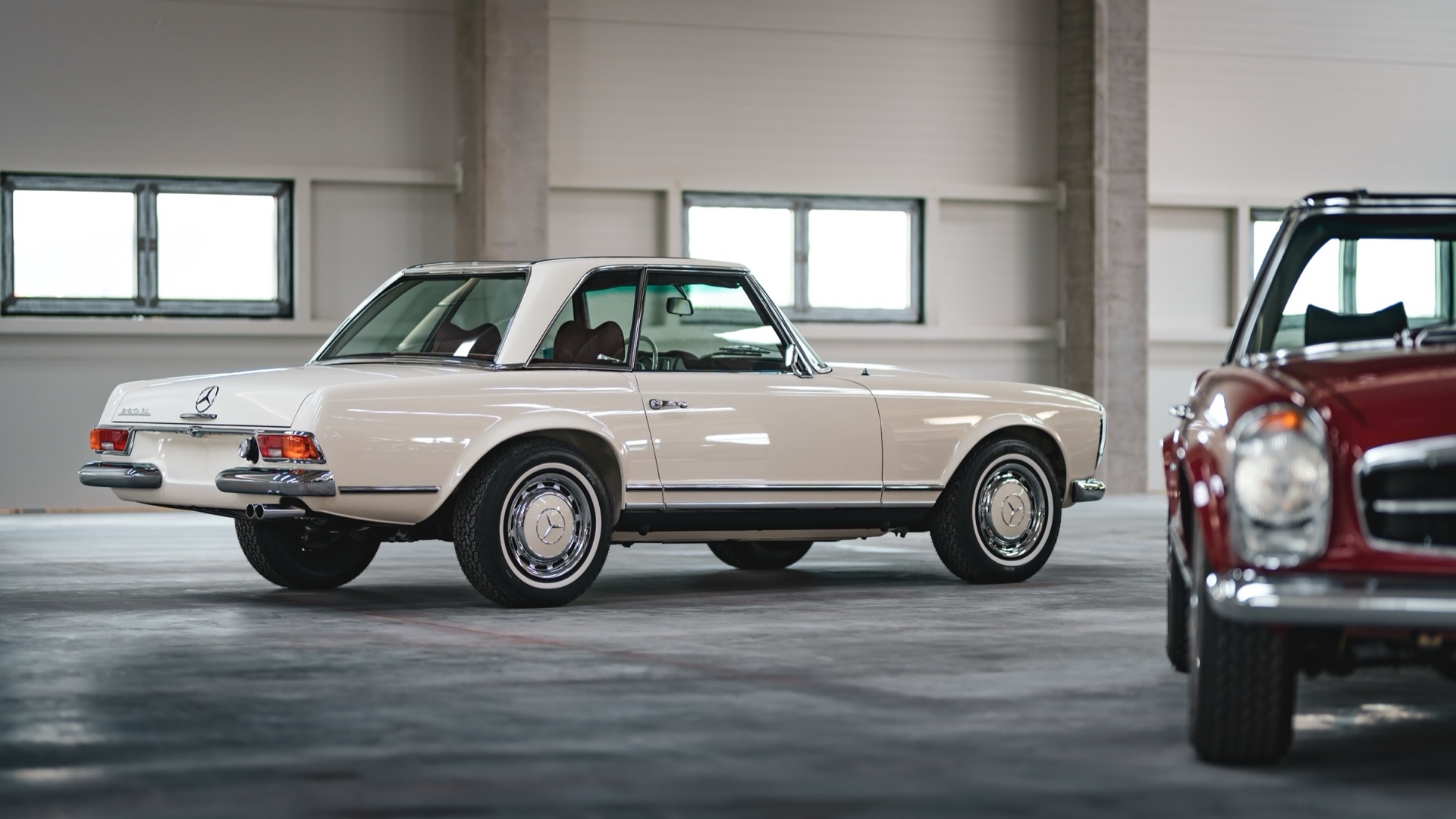 Cream Pagoda with its hardtop, rear three-quarter view in the hall
