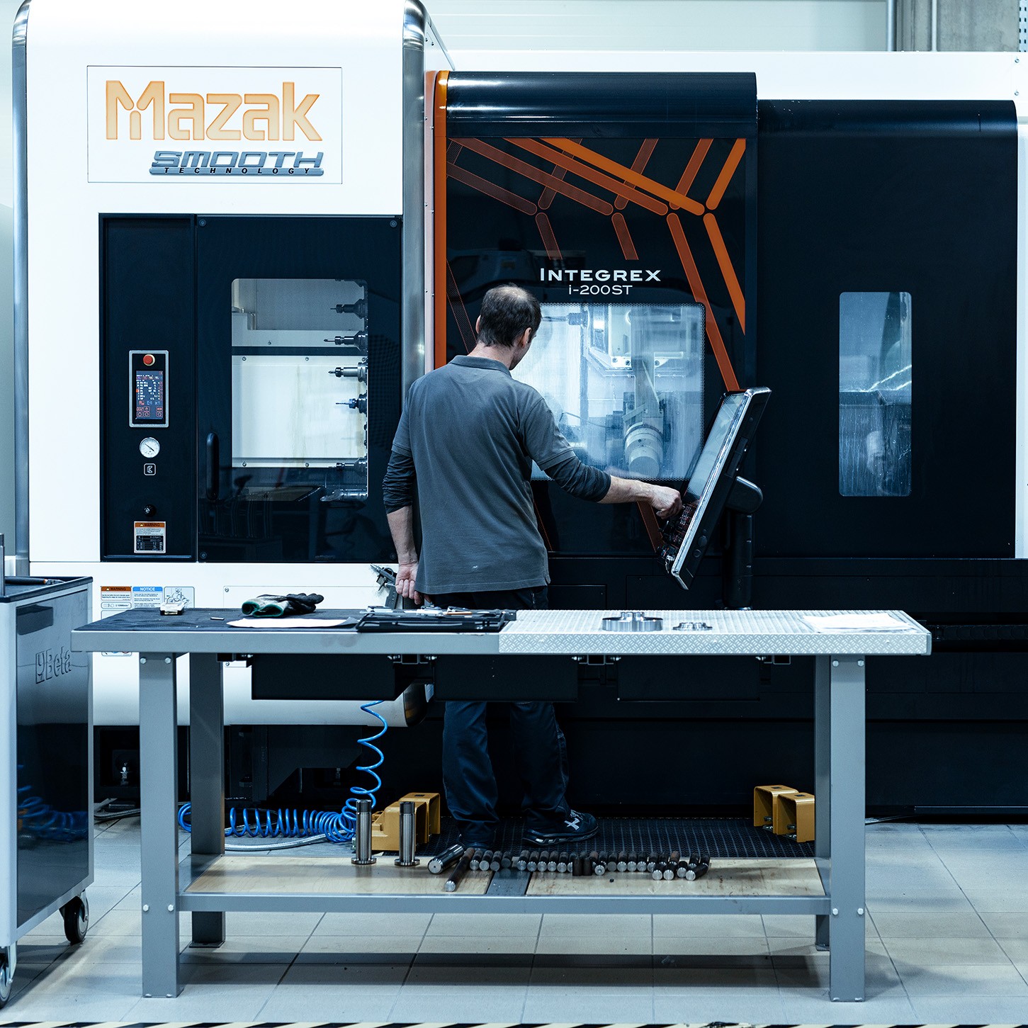 A machinist at work in the CNC workshop