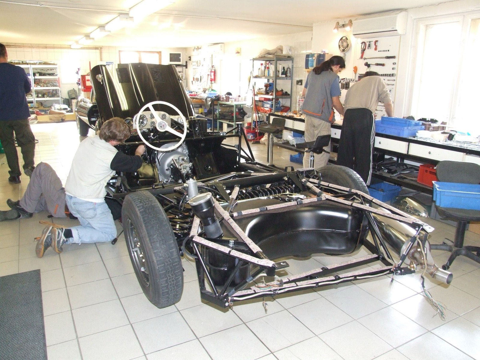 The 300 SL chassis and engine taking shape in the old garage workshop